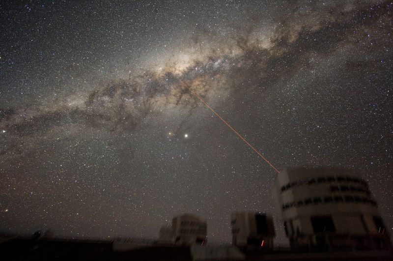 A laser is being used to measure the effect of the atmosphere on astronomical observations, but it looks like the telescope is shooting at the Milky Way
