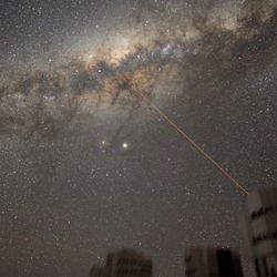 A laser is being used to measure the effect of the atmosphere on astronomical observations, but it looks like the telescope is shooting at the Milky Way