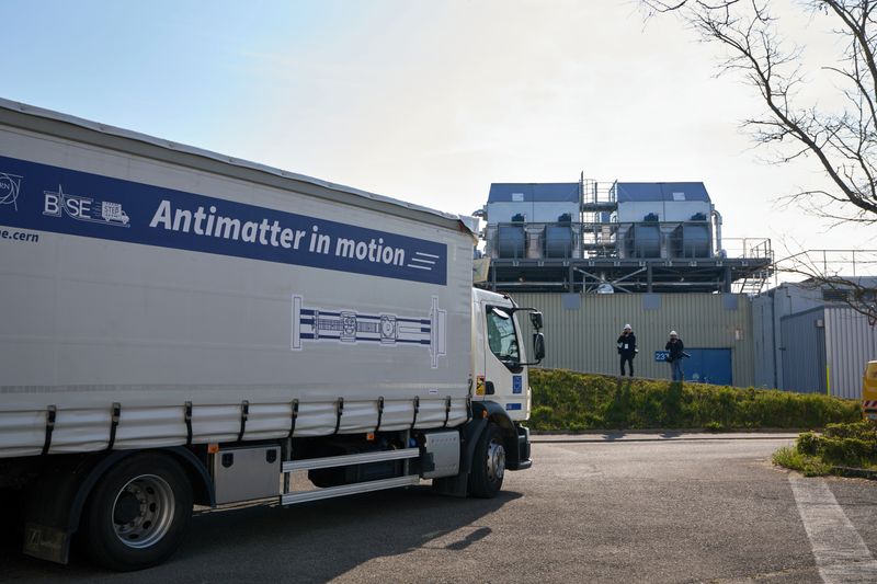 A truck at cern with a sing on its side that says antimatter in motion.