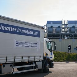 A truck at cern with a sing on its side that says antimatter in motion.