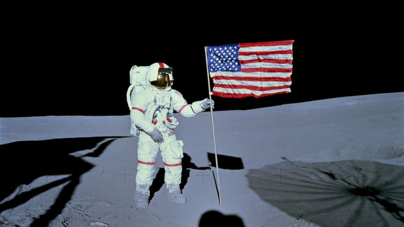 Apollo 14's Alan Shepard planting the U.S. flag on the Moon.