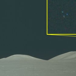 hills on the moon and in a very zoomed in inset three colorful dots.