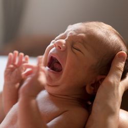 close-up of a newborn baby crying