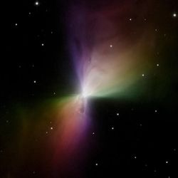 Hubble Space Telescope image of the Boomerang Nebula; the nebula is rainbow-colored and bow-shaped, surrounded by a black background dotted with stars