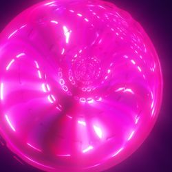 A pink bubble with glowing clusters insideand other bubbles