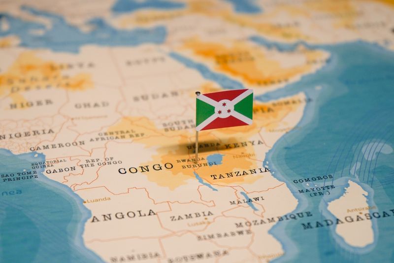 map of Africa with a small paper Burundi flag pinned where Burundi is located