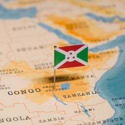 map of Africa with a small paper Burundi flag pinned where Burundi is located