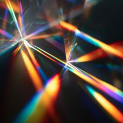 glass crystals producing interlocking rainbow reflections in this image