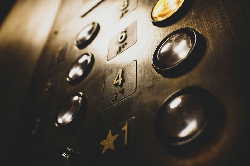 close up angled shot of some buttons inside an elevator