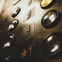 close up angled shot of some buttons inside an elevator