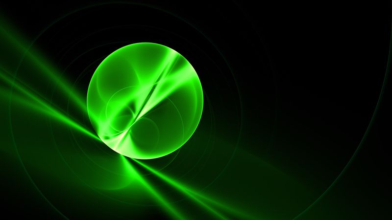 A glowing green orb represneing some particle interaction, with light reflecting in and out of it