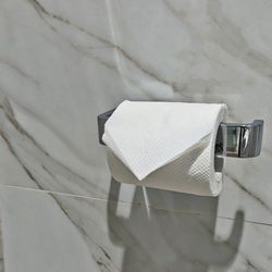 folded toilet paper is a common sight in hotel bathrooms