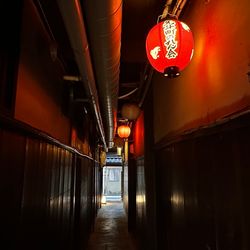 A lantern lights up a lonely street in Kyoto, Japan.