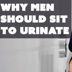a man sitting to pee