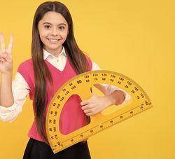 schoolgirl holding a giant protractor in one hand and making a 'peace' sign with the other