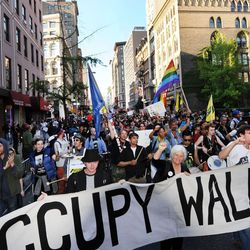 Occupy Wall Street demonstrators march down Broadway toward Lower Manhattan in 2012.