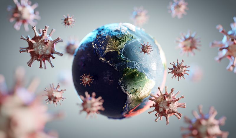 concept art of pandemic; virus particles surrounding a globe