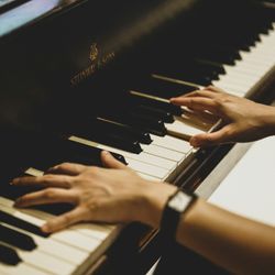 hands on a Steinway grand piano