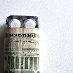 Prescritpion pills wrapped in $20 bills