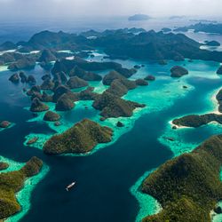 aerial drone image of a remote, hilly group of tropical islands