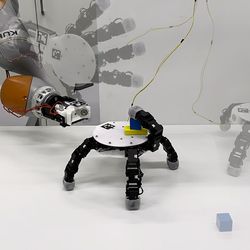 The robotic hand can detach, crawl to retrieve several objects, and reattach.