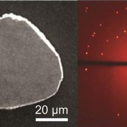 a grey slab and next to it a glowing red orb with bright dots representing the diffraction 