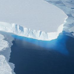 Thwaites Glacier in West Antarctica, a large body of ice surrounded by blue water.