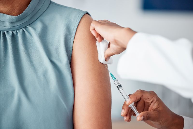 close up of a vaccine being injected into someone's arm