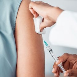 close up of a vaccine being injected into someone's arm