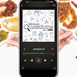 A smartphone showing an episode of IFLScience's We Have Questions podcast about which animals have the worst table manners.