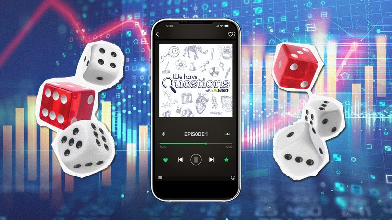 A picture of a phone playing a podcast episode showing IFLScience#s 'We Have Questions' podcast logo. The phone is surrounded my dice and data charts 
