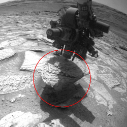 The Curiosity rover's drill bit, stuck in a piece of Martian rock.