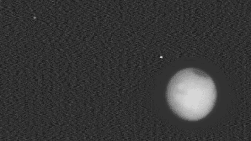 Deimos (top left), Mars (bottom right) and Phobos (above Mars).