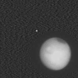 Deimos (top left), Mars (bottom right) and Phobos (above Mars).
