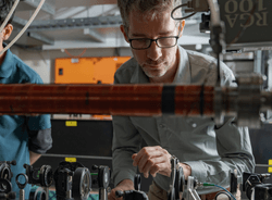Yogesh Sridhar and Dr Sean Hodgman (right) making adjustments on the way to demonstrating the entanglement of atoms' momentum for the first time