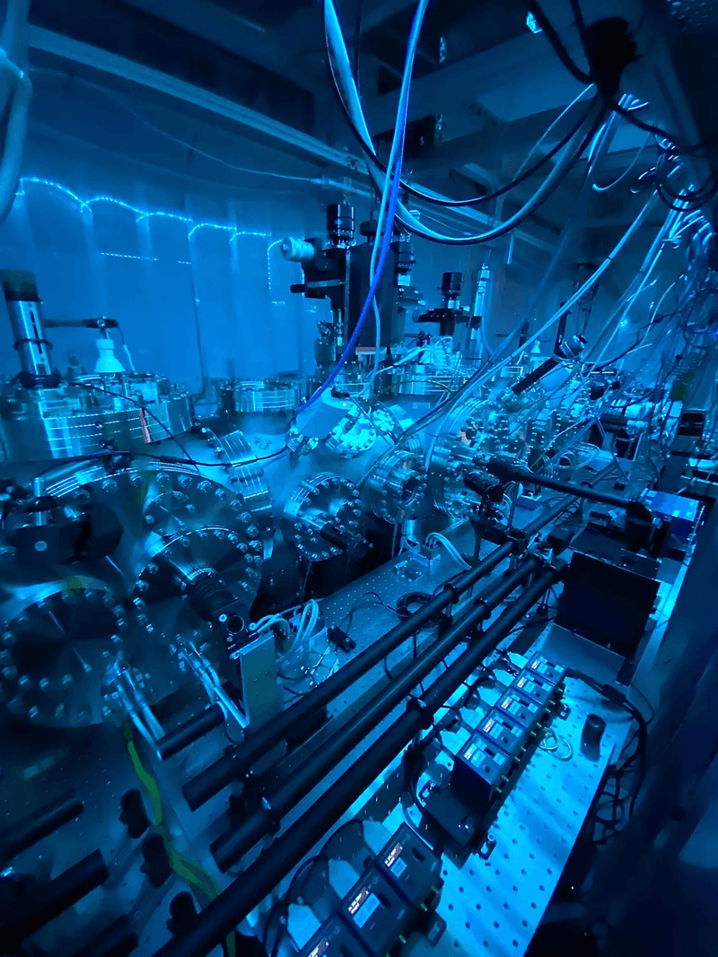 a metallic cylinders connected to gauges and cables where the quantum mechanics magic happens.