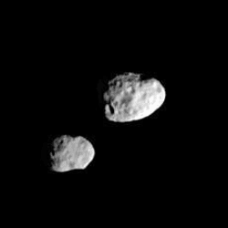Janus (right) and Epimetheus look like they're almost touching in this photo, in keeping with their almost identical orbits, but this image was taken when they were thousands of kilometers apart.