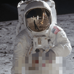 Buzz Aldrin in astronaut suit on the Moon. Neil Armstrong can be seen in the reflection on his visor.