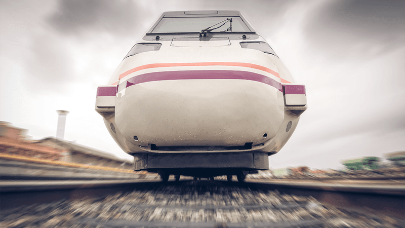 A train moving along train tracks towards the camera.