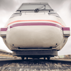 A train moving along train tracks towards the camera.